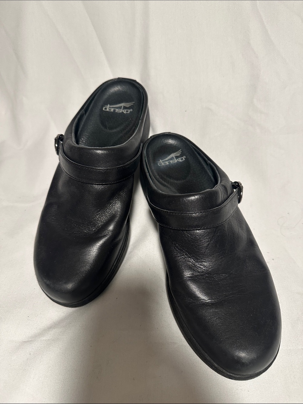 Dansko Black Leather Slip-On Clog with Buckle Strap